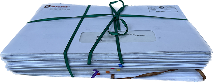 an image of the stack of envelopes from the project, tied with ribbon